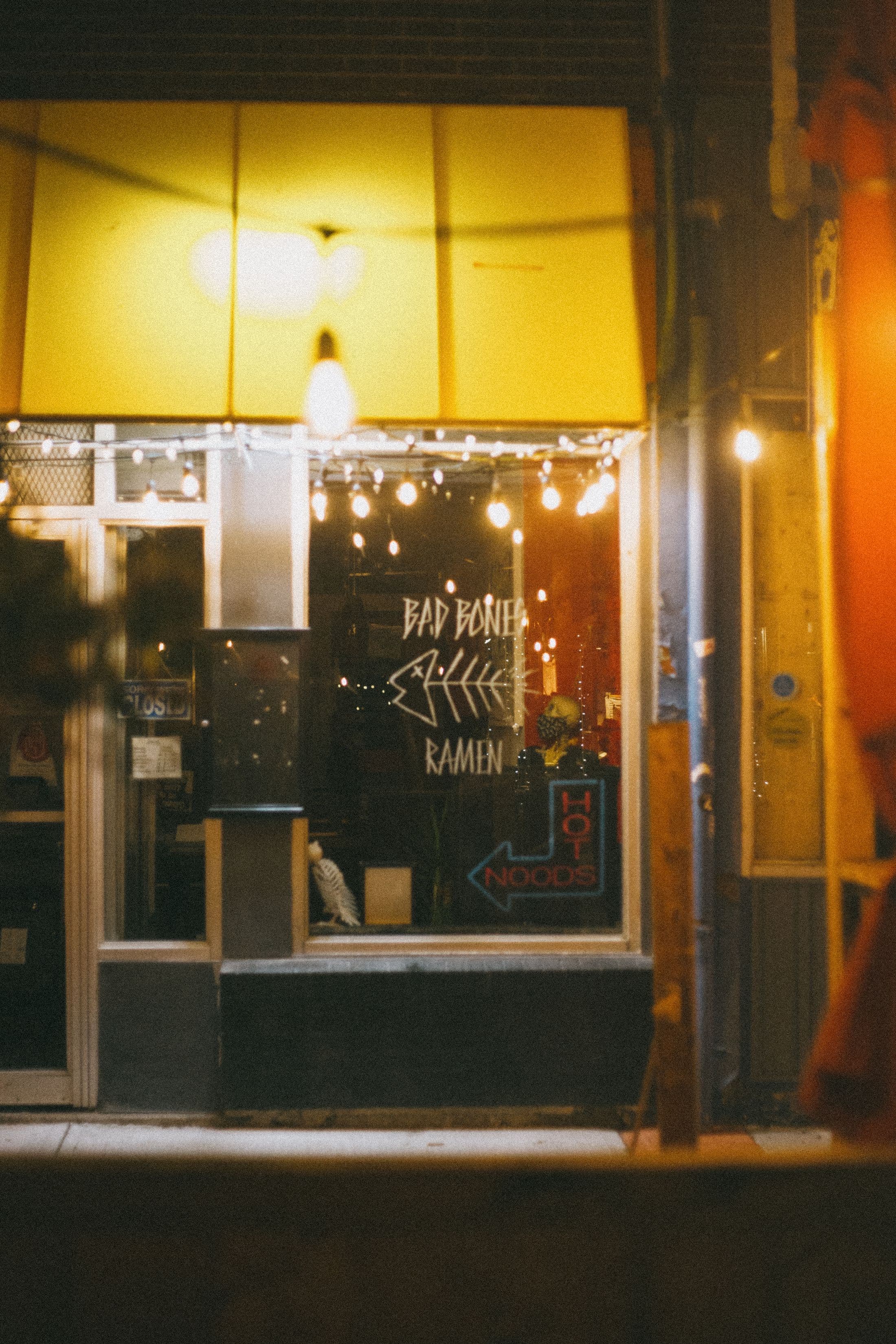 A lit shopfront window at night