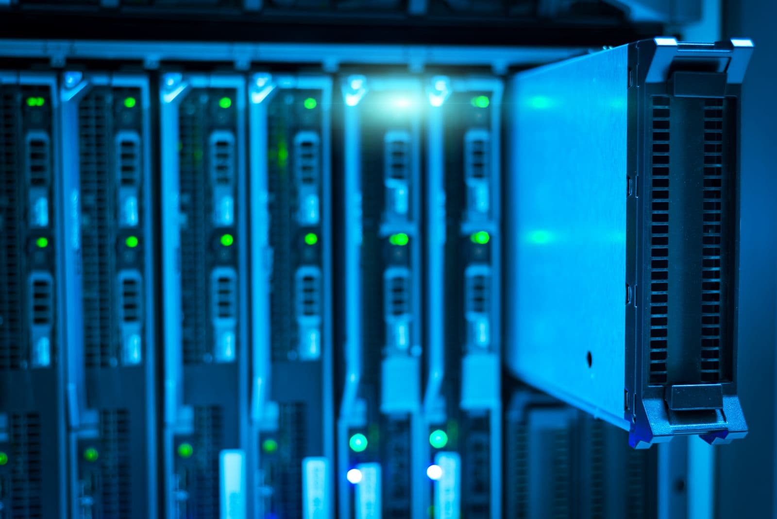 Server racks lit blue in a data centre