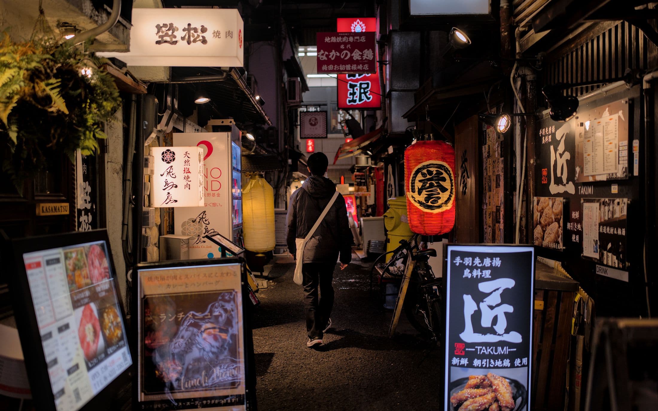 Lanterns lighting a narrow street at night